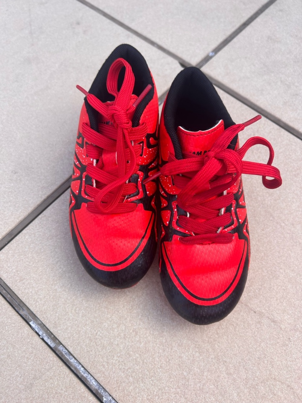 Kids red soccer cleats